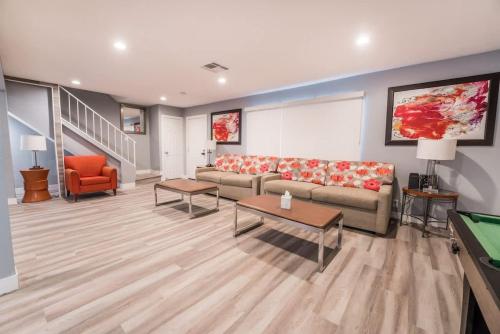 a living room with a couch and a pool table at Luxury Living Just Steps from the Strip in Las Vegas