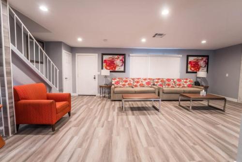 a living room with a couch and a table and chairs at Luxury Living Just Steps from the Strip in Las Vegas