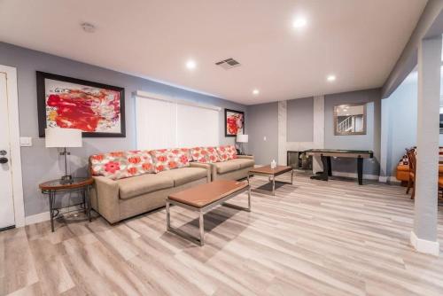 a living room with a couch and a table at Luxury Living Just Steps from the Strip in Las Vegas