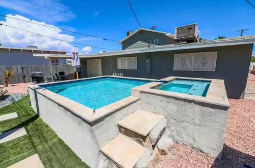 a swimming pool in the backyard of a house at Modern Elegance in the Heart of Las Vegas in Las Vegas