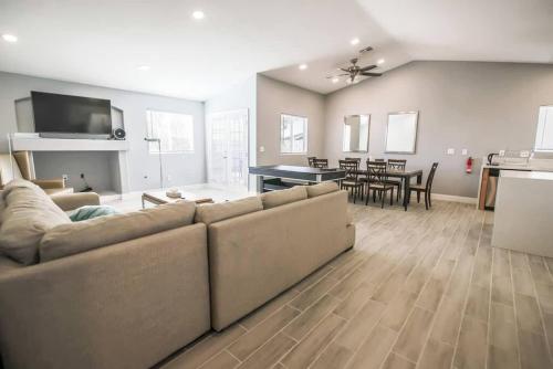 a living room with a couch and a dining room at Spacious Stylish and Convenient in Las Vegas