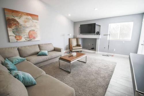 a living room with a couch and a table at Spacious Stylish and Convenient in Las Vegas