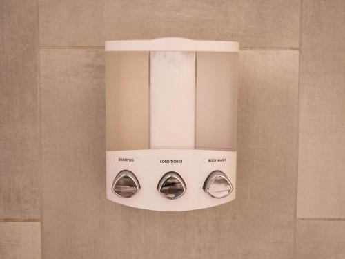 a chandelier hanging from a wall in a bathroom at Updated Cabin near Beach&Ski HotTub Sauna Pets EV in Tahoe City