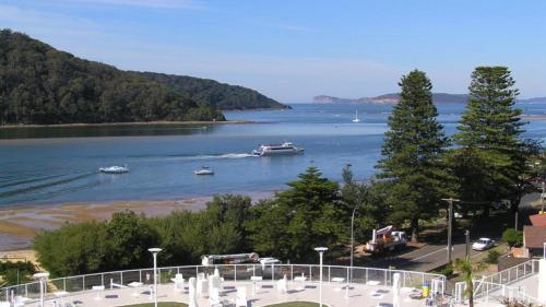 a view of a river with boats in the water at Panorama Daze Ettalong Beach in Ettalong Beach