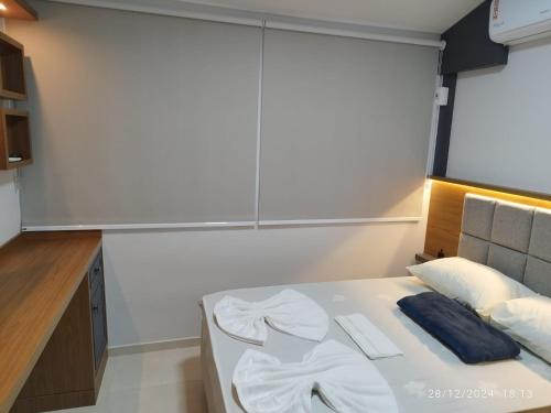 Postel nebo postele na pokoji v ubytování Loft 01 dormitório
