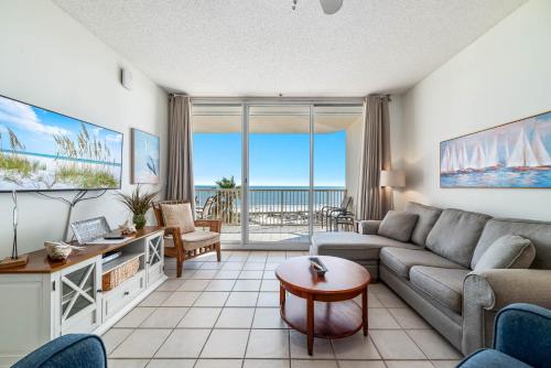 a living room with a couch and a table at Beach Club D-506 Beachfront-Tons of Amenities-3-Restaurants-Incredible Views in Gulf Shores