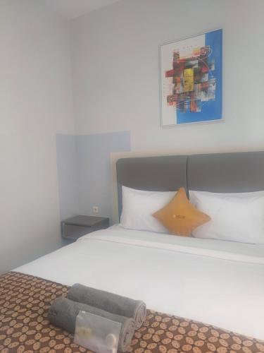 Ένα ή περισσότερα κρεβάτια σε δωμάτιο στο OKE Living Syariah