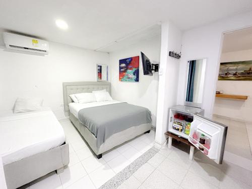 Postel nebo postele na pokoji v ubytování Hotel CasaBlanca Cartagena