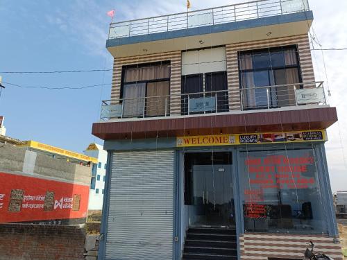 a building with a revolving door in front of it at SSR-Shree Shyam Residency in Khātu