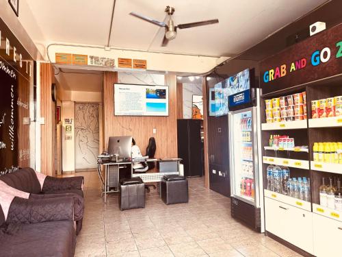 a store with a person sitting at a desk in a store at Ica Adventures II in Ica