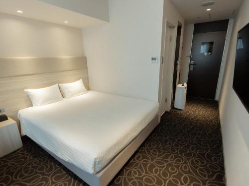 Katil atau katil-katil dalam bilik di Hotel Aqua Citta Naha