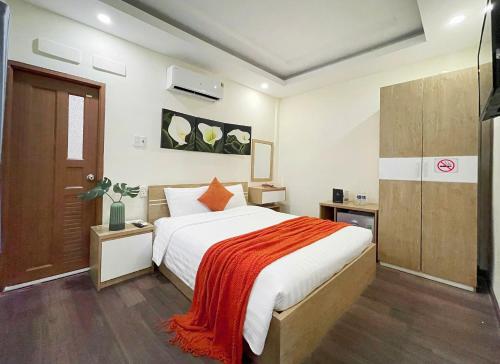 Postel nebo postele na pokoji v ubytování Joi Boutique Bãi Trước
