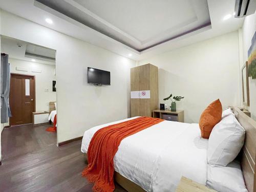 Postel nebo postele na pokoji v ubytování Joi Boutique Bãi Trước
