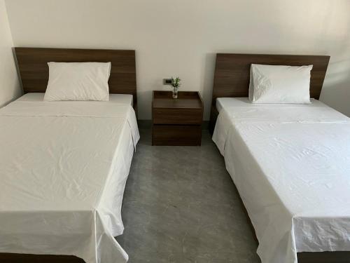 Postel nebo postele na pokoji v ubytování Khách sạn Hải An Quế Võ