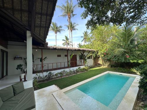 a view of the backyard of a house with a swimming pool at SEACLUB Siargao in General Luna