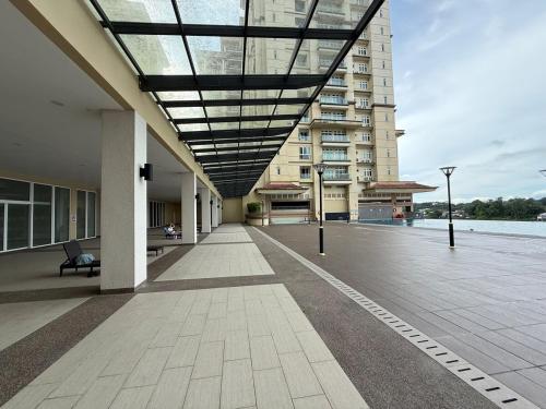 a building with a glass ceiling and a walkway at Riverine Diamond Condominium at City Centre in Kuching