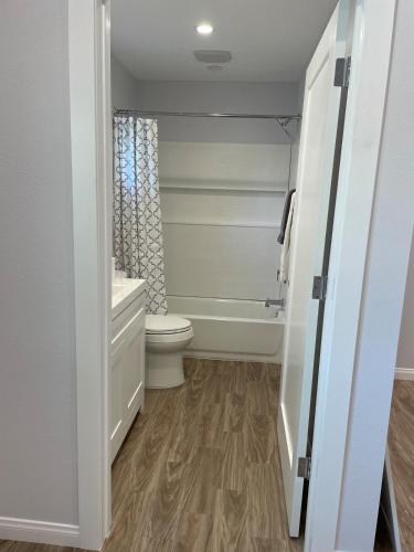 a bathroom with a toilet and a shower at Modern 1-bedroom Studio with Kitchen and Laundry in Santa Clarita