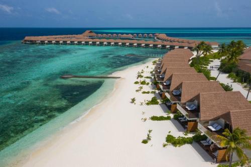 an aerial view of the beach at the excellence punta cana resort at Cinnamon Velifushi Maldives in Keyodhoo