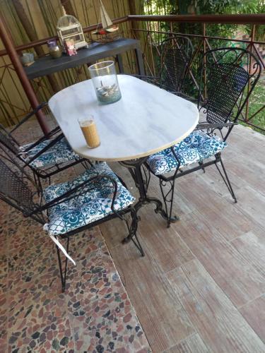 a table and two chairs sitting on a patio at Bamboo garden in Nea Iraklia