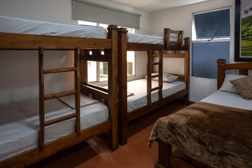 Cama o camas de una habitación en Finca hotel nuevo futuro