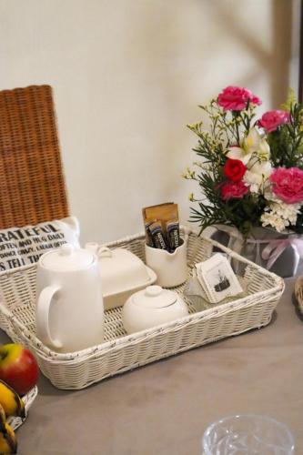 a basket with candles and flowers on a table at Beach Retreat by C in Bain Boeuf