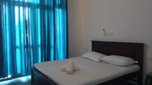 Cama o camas de una habitación en Ridmi Home Stay