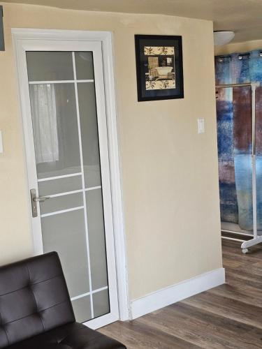 a sliding glass door in a living room at Studio in Kelso
