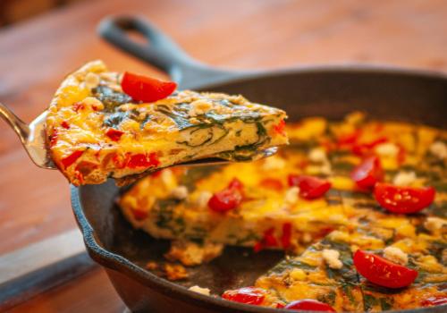 a spatula holding a slice of pizza in a pan at The Inn at Beulah Farm - The Barn in Whitley City