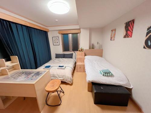 Una cama o camas en una habitación de 貴頂府邸 関原 KICYO HOUSE No3