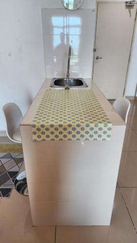 a kitchen with a sink and a counter top at The Viana Apartment 1 in Kota Bharu