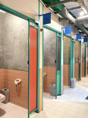 a bathroom with several toilets in a building at The Urbanists BKK Entire Floor 4-6 people 4Beds 4Baths near Medpark Hospital , Queen Sirikit Convention hall , Benjakitti Park in Bangkok