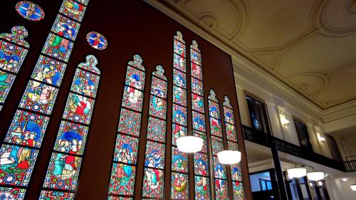 a large stained glass window in a building at Tabist THE GREEN OTARU in Otaru