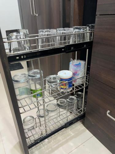 a drawer filled with dishes and other items at Peaceful studio home in South Goa in Salcete
