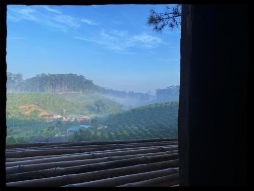 a view out of a window of a mountain at Mộc Lan’s House in Phi Liêng