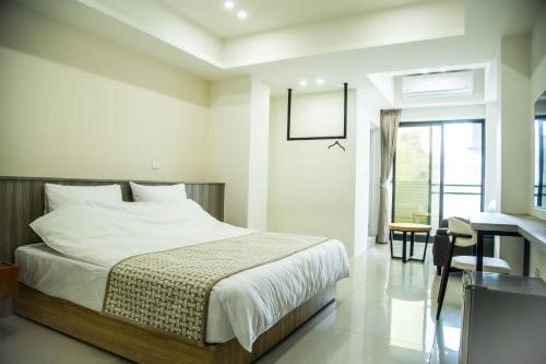 Cama o camas de una habitación en 嘉義旅人 Chiayi Traveler
