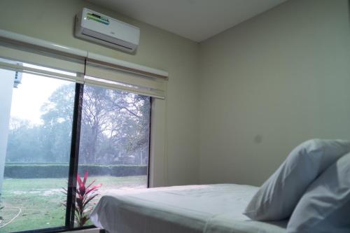 Katil atau katil-katil dalam bilik di Casas Jardín