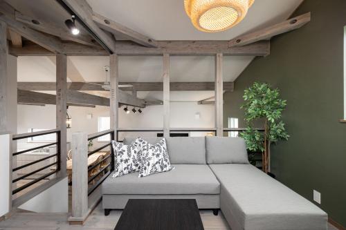 a living room with a couch and a table at Villa Gotemba Fuji in Gotemba