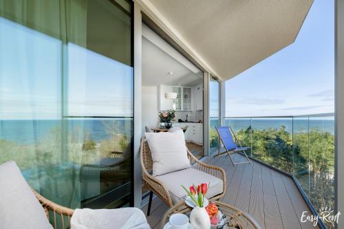 a balcony with a view of the ocean at Prestige Pinea 613 - basen, sauna, jacuzzi w cenie pobytu - Easy - Rent Apartments in Pobierowo