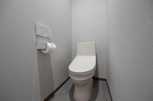 a bathroom with a white toilet in a room at Villa Gotemba Fuji in Gotemba