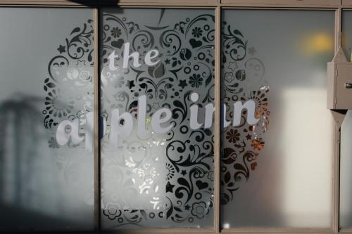 a glass door with the words the office on it at The Apple Inn in Batlow