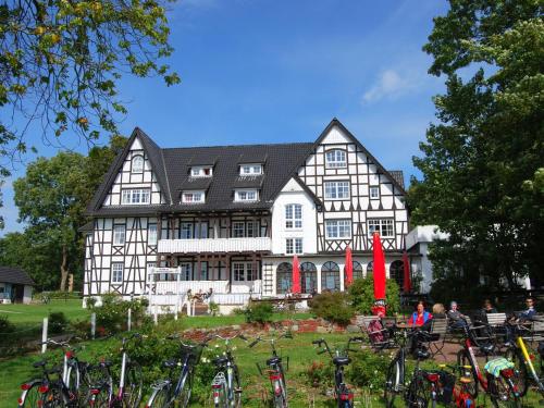 a large house with bikes parked in front of it at Ferienwohnung Hiddensee Hitthim in Kloster