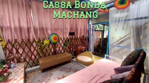 a room with a fence and a table and chairs at Cassa Bonda Std Family Room in Machang