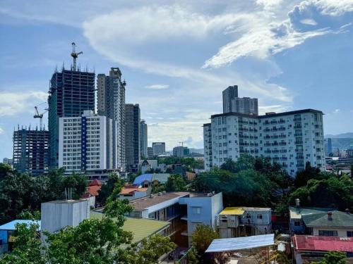 a view of a city with tall buildings at Almond Suites by Hiverooms in Cebu City