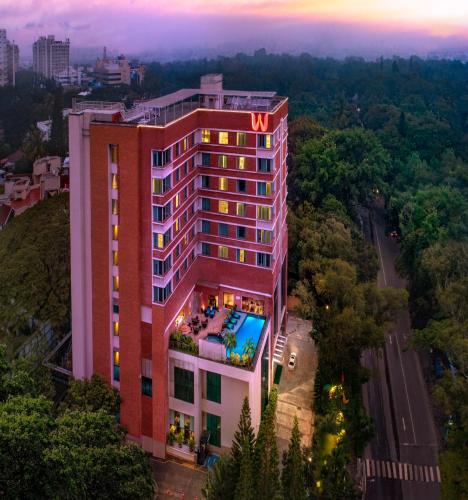 an overhead view of a hotel building with a pool at Welcomhotel by ITC Hotels, Richmond Road, Bengaluru in Bengaluru