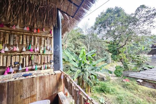 a view from the outside of a building with a fence at Mae Mae Home in Ban Tham