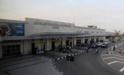 a large building with cars parked in front of it at Cool Flat Cidade - Airport in Luanda