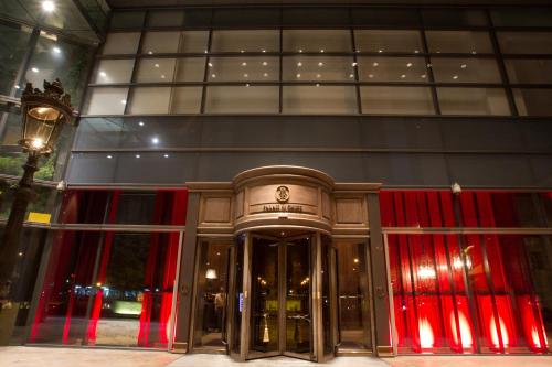a building with a revolving door in front of it at Palais de Chine Hotel in Taipei