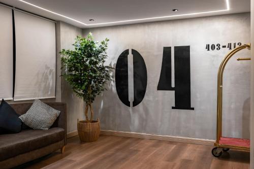 a lobby with a wall with the number on it at BRYQS Hotel in Kuala Lumpur