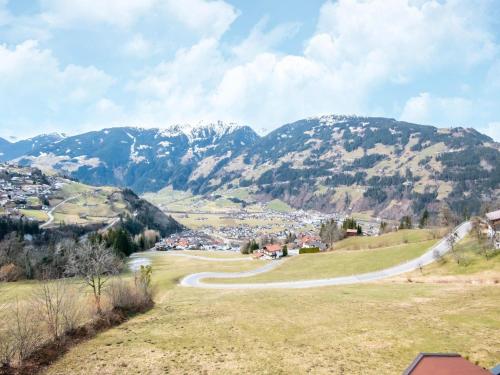 a winding road in a valley with mountains in the background at Chalet in Zell am Ziller near Ski Lift in Gerlosberg
