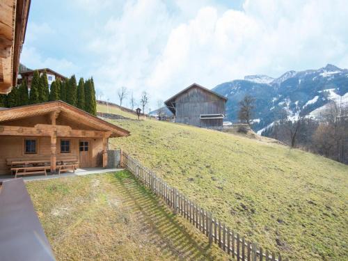 a house on top of a hill with a fence at Chalet in Zell am Ziller near Ski Lift in Gerlosberg